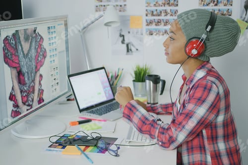 Preview: Trendy designer working with computer