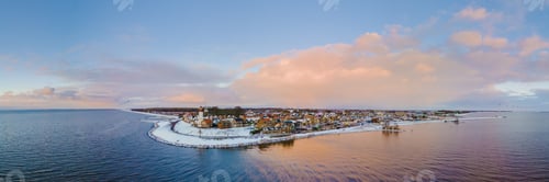 Preview: panoramic view of the Lighthouse of Urk during winter with snow in the Netherlands