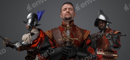 Preview: Handsome conquistador with two guards against grey background