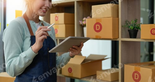 Preview: Startup small business entrepreneur SME, asian woman checking order. Portrait young Asian small