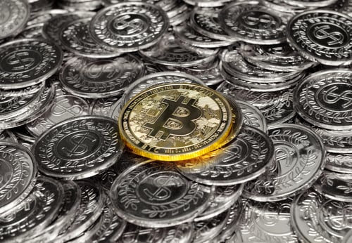 Preview: Gold bitcoin cryptocurrency on pile silver coins a lot of