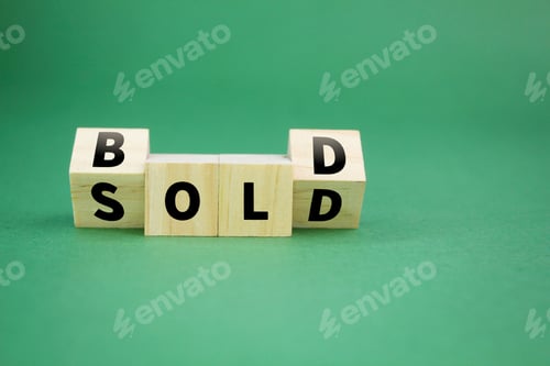 Preview: wooden cube with the word sold in bold.