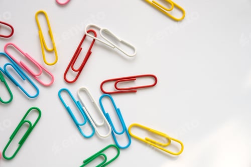 Preview: Coloured paper clips close-up on a white background