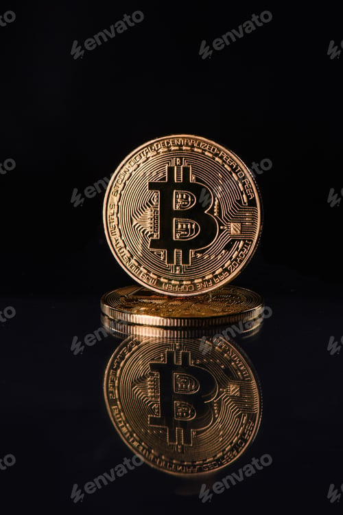 Preview: Close up view of golden bitcoins isolated on black