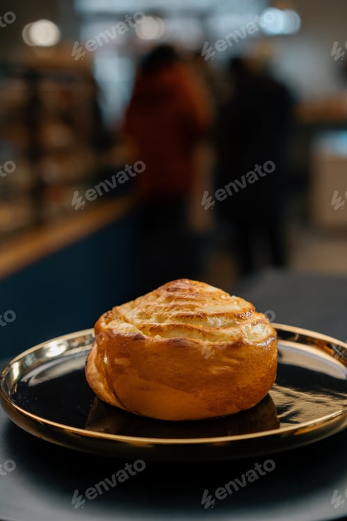 Preview: Close-up, bakery - delicious bun with jam on rotating surface