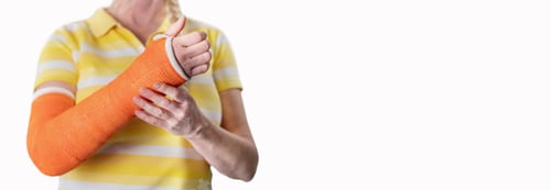 Preview: woman with broken arm and an orange plaster plastic bandage on awhite background,modern materials