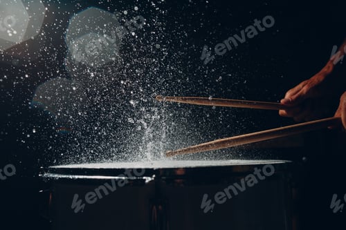 Preview: Drum sticks drumming beat rhythm on drum surface with splash water drops