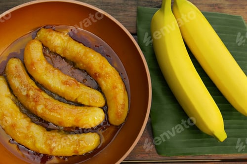 Preview: Delicious fresh and fried bananas on wooden table, flat lay