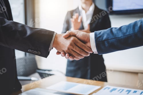 Preview: Business shaking hands after discussing good deal of Trading to sign agreement and become a partner