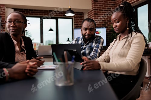 Preview: African american colleagues brainstorming ideas in office