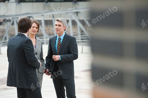 Preview: Germany, Hamburg, Business people discussing together