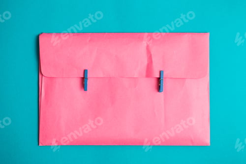 Preview: The pink envelope holds the clothespins. Minimalism