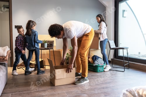 Preview: Mixed race family moving into their new home.