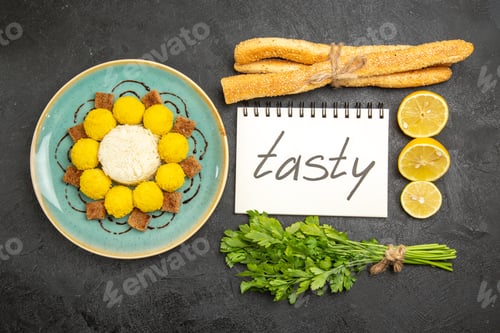 Preview: top view delicious candies with cake greens lemon and tasty word on dark background candy sweet tea