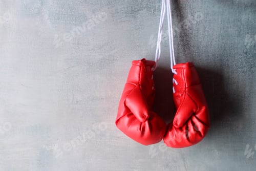 Preview: Red boxing gloves hang on wall