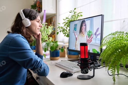 Preview: Online meeting of teenagers friends, guy at home talking with smiling girl