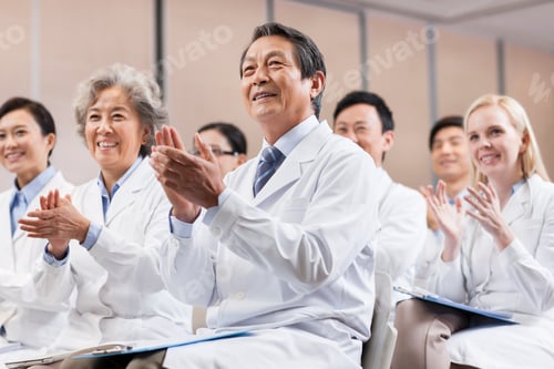 Preview: Medical workers clapping in a meeting