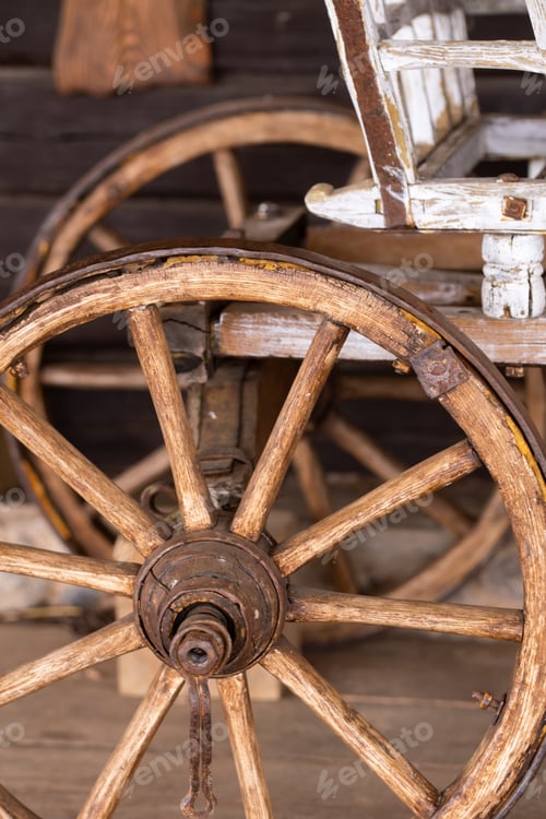 Preview: old wooden wheels are on the carriage at the ranch