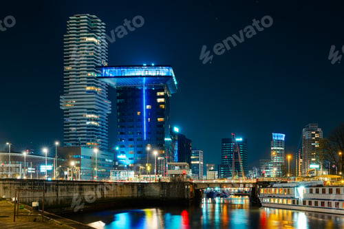 Preview: Panoramic view of the night city. Rotterdam city skyline. City towers illuminated panorama