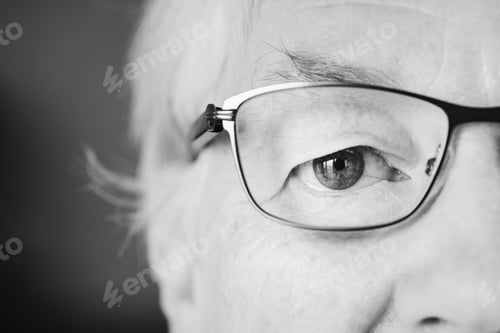 Preview: Portrait of white elderly woman closeup on eyes wearing specatac