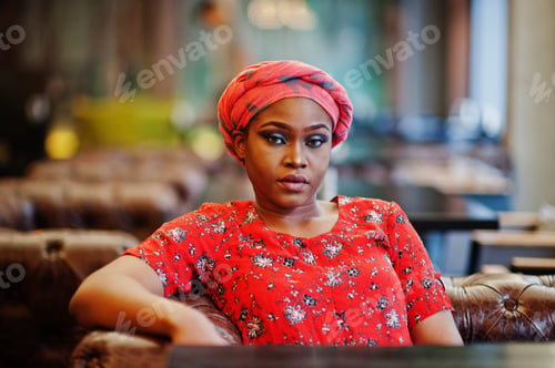 Preview: Stylish african woman in red shirt and hat
