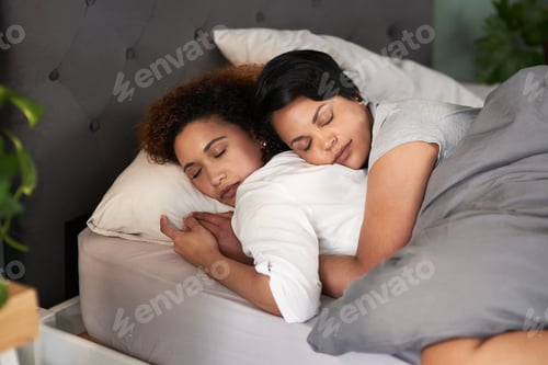 Preview: This is where I belong. Shot of an affectionate couple sleeping in their bed.