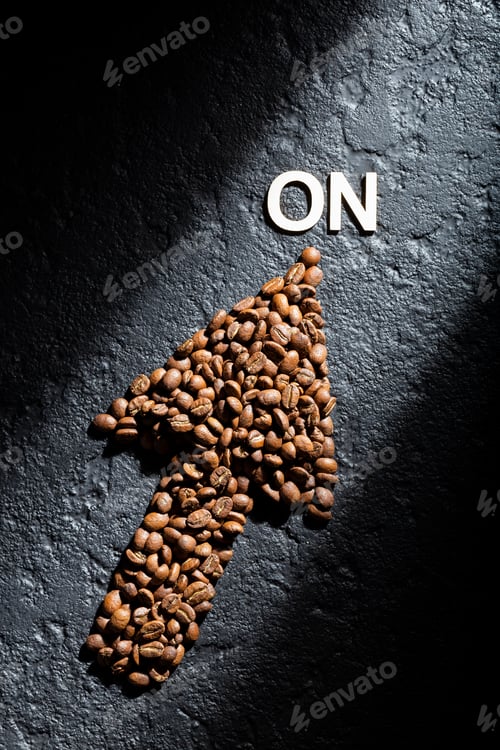Preview: Coffee beans on a black background, concept of "coffee makes you active"