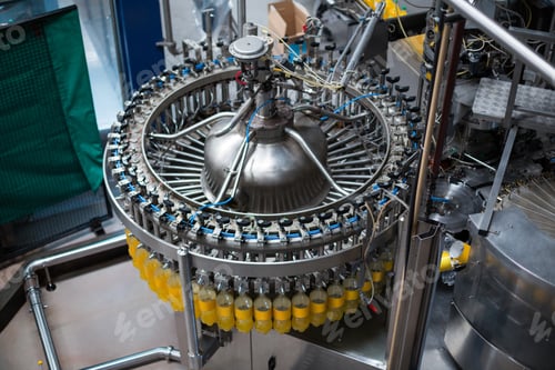 Preview: Bottles being filled with juice on production line