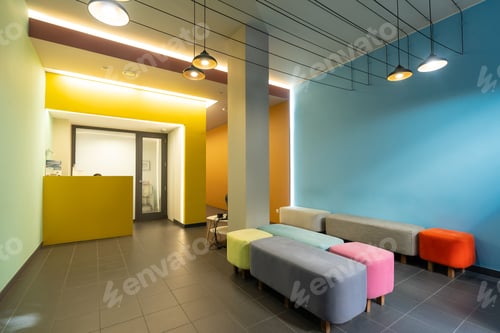 Preview: Waiting room of a modern dental clinic with colored sofas