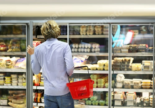 Preview: Man Choosing Frozen Food From A Supermarket Freezer