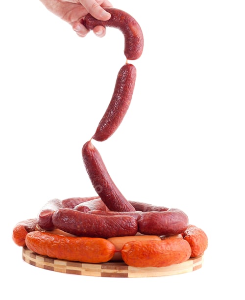 Preview: hand holding sausages