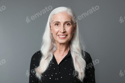 Preview: Portrait of beautiful mature woman on grey background