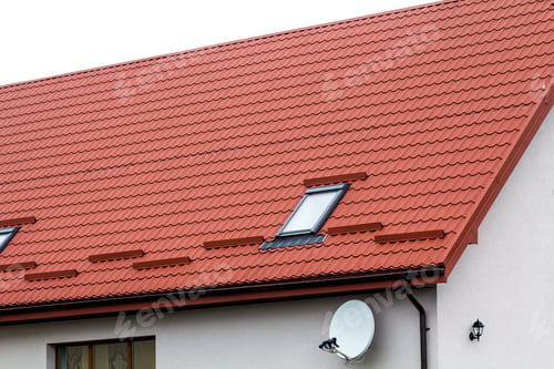 Preview: Roof of a new house made from red roofing tiles