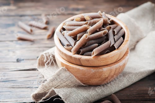 Preview: Uncooked italian buckwheat pasta on the wooden table
