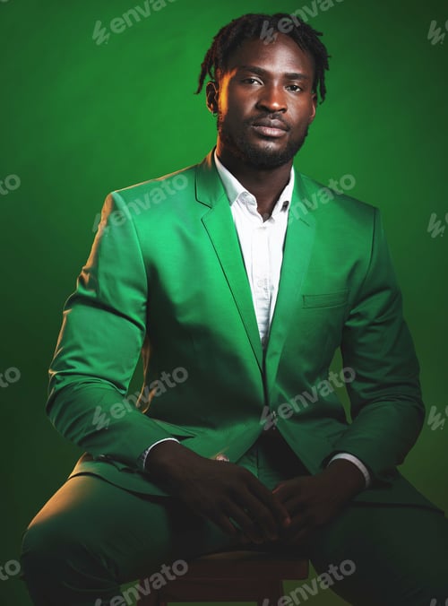 Preview: Fashion, formal and portrait of a black man in a suit sitting on a chair in studio with a luxury ou