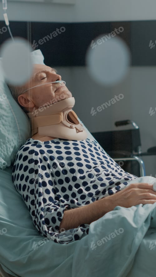 Preview: Elder patient recovering after surgery in hospital ward bed