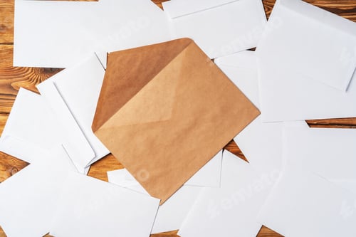 Preview: Stack of envelopes on working desk top view. Business mail