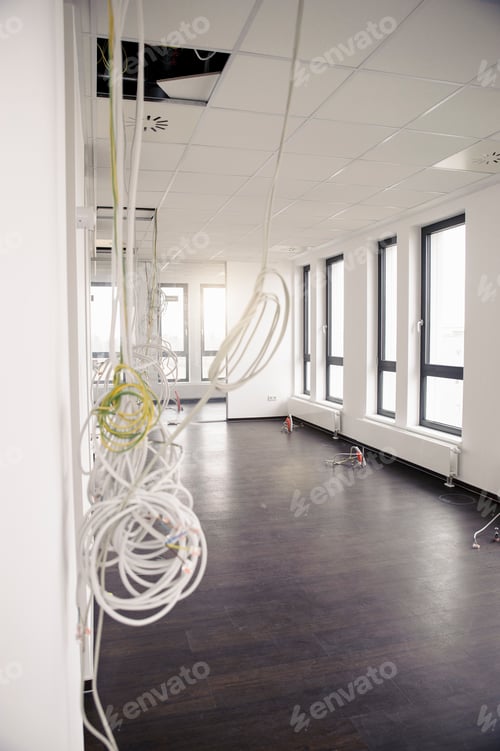 Preview: Network and power cables hanging from new office ceiling