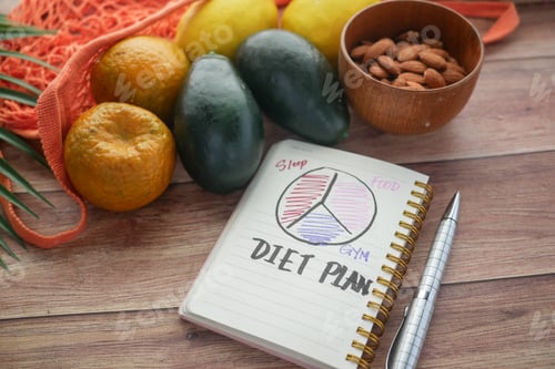 Preview: Diet plan with almond nuts and fresh fruit on table