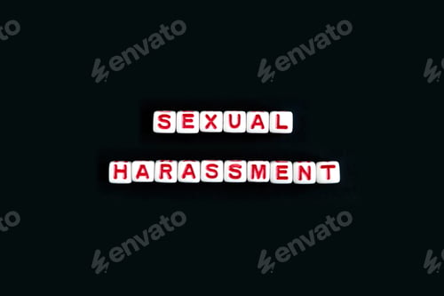 Preview: Phrase "sexual harassment" made out of beads on black background