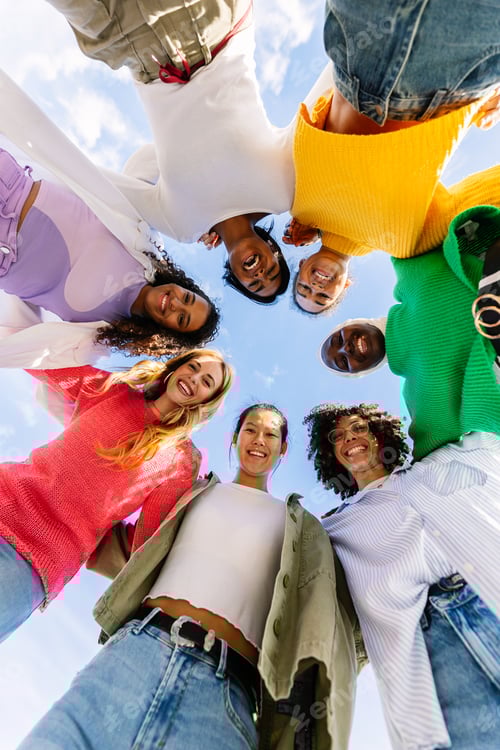 Preview: Low angle view vertical photo of young diverse women standing together outdoors