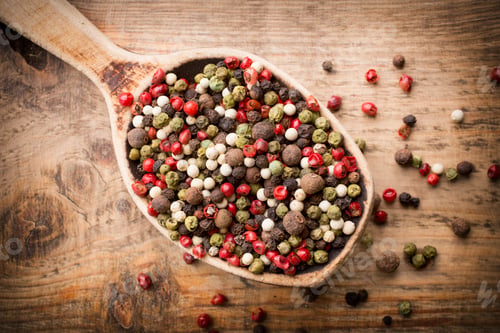Preview: Spice mix a wooden spoon on a wooden background.