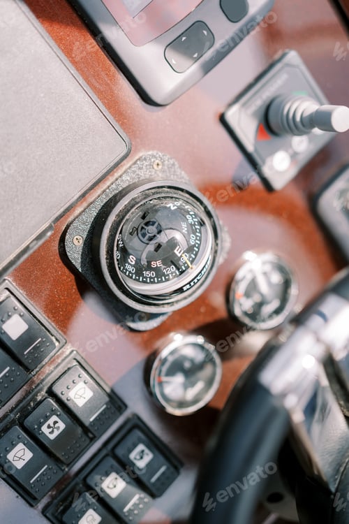 Preview: Compass near the control panel of a motor yacht. Top view