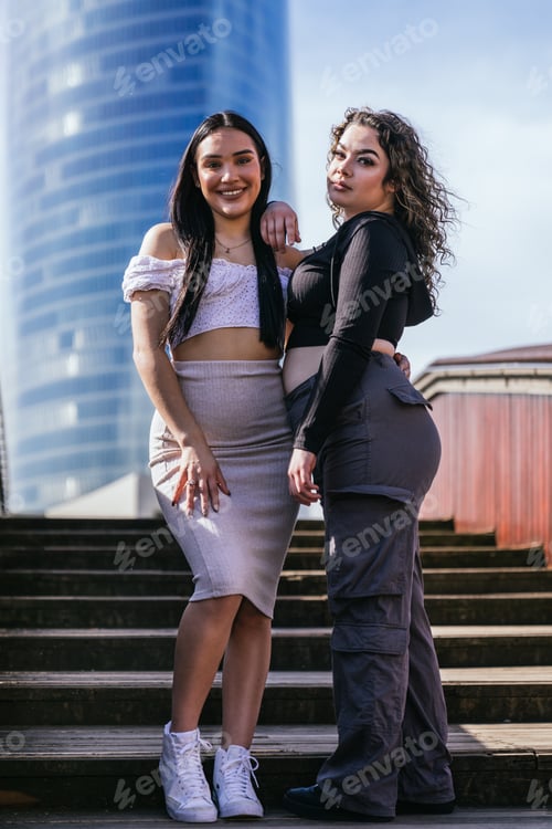Preview: Latina Duo Takes the Streets: Casual, Modern Fashion on a Sunny Day by the Wooden Stairway