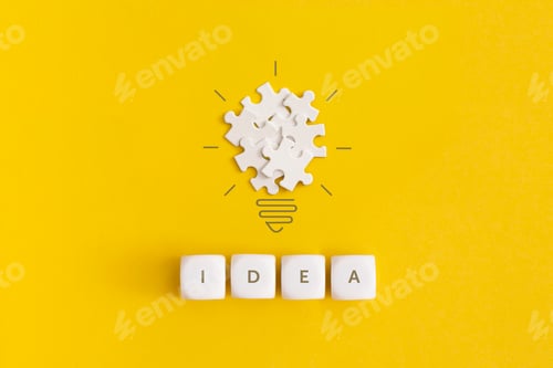 Preview: Light bulb from puzzles on yellow background. Inspiration and creative idea concept.