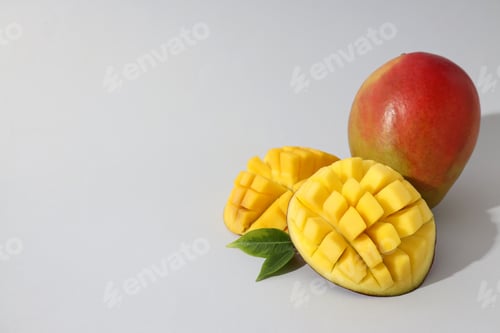 Preview: Ripe sliced mango on a white background