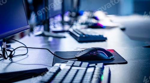 Preview: Computer mouse and keyboard on the desk of an esports competition.