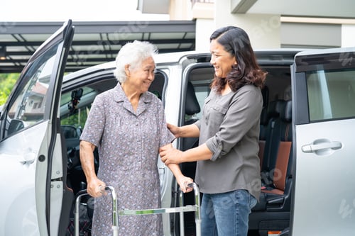Preview: Asian senior woman patient sitting on walker prepare get to her car, healthy strong medical concept.