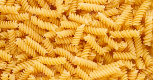 Preview: Abundant Pile of Dry Fusilli Pasta Filling Frame