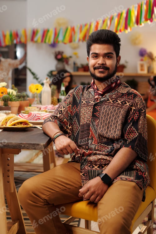 Preview: Man sitting by table with homemade food